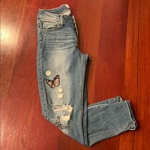 Black Daisy skinny jeans with embellishments